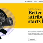 PartnerCentric homepage showcasing attribution technology with hand holding binoculars