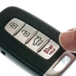 Car remote key fob opened to show battery compartment