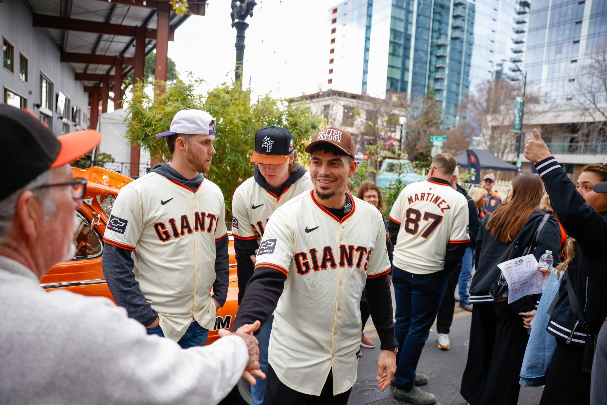 Willy Adames of the San Francisco Giants shaking hands with a fan at the 2025 Giants FanFest in San Jose