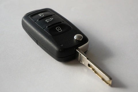 An all-in-one car key and fob combo unit