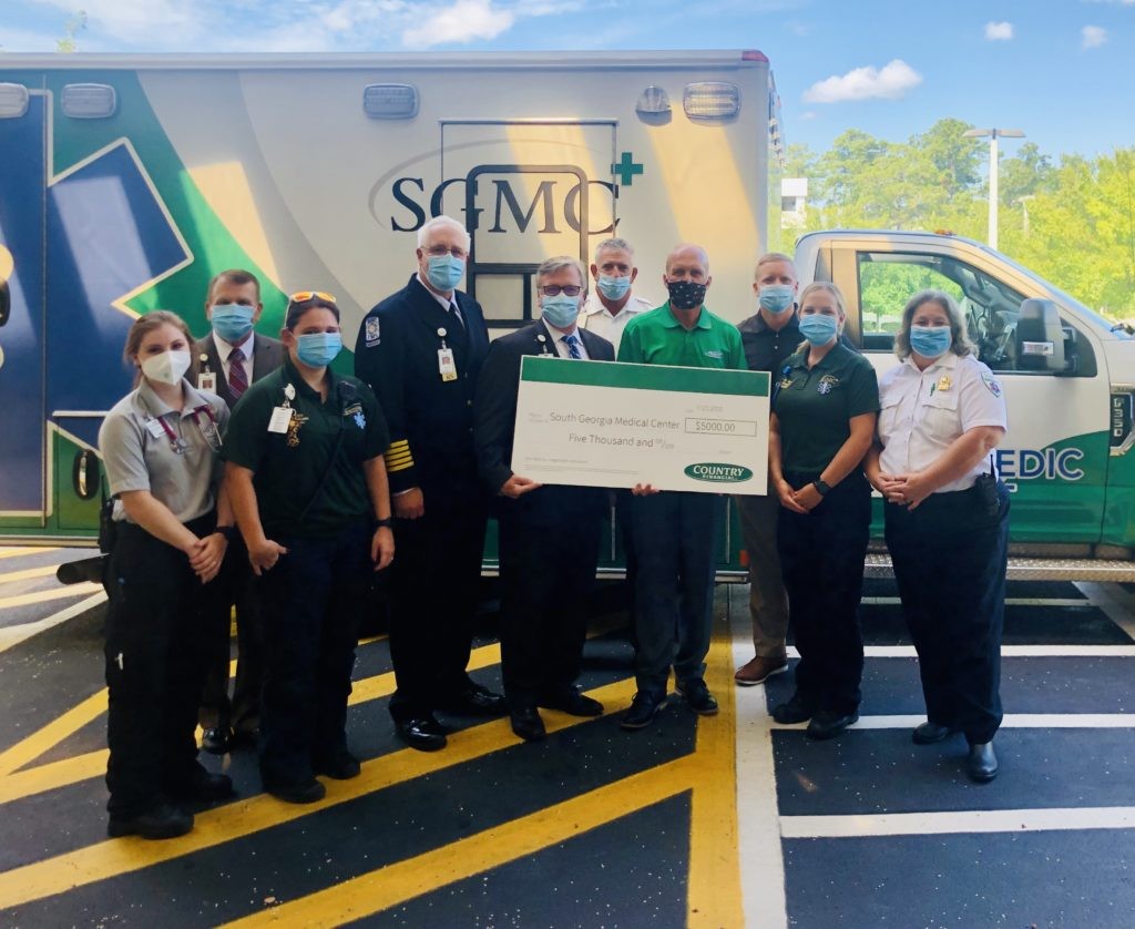 Ford Bowen and Jamie Joiner of COUNTRY Financial present a $5,000 check to South Georgia Medical Center for their Emergency Medical Services (EMS) program through Operation Helping Heroes.