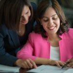 Professional women collaborating on a career development plan within the refugee career pathways program.