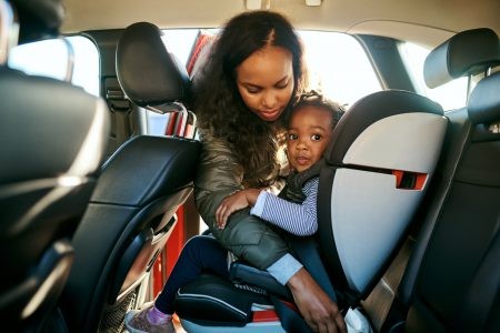 Diverse group of families participating in the Goodwill Easter Seals Car Seat Safety Program