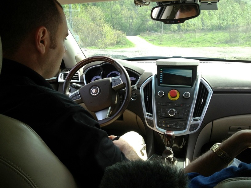 Jarrod Snider in the autonomous-driving lab, emphasizing computer control over vehicle functions