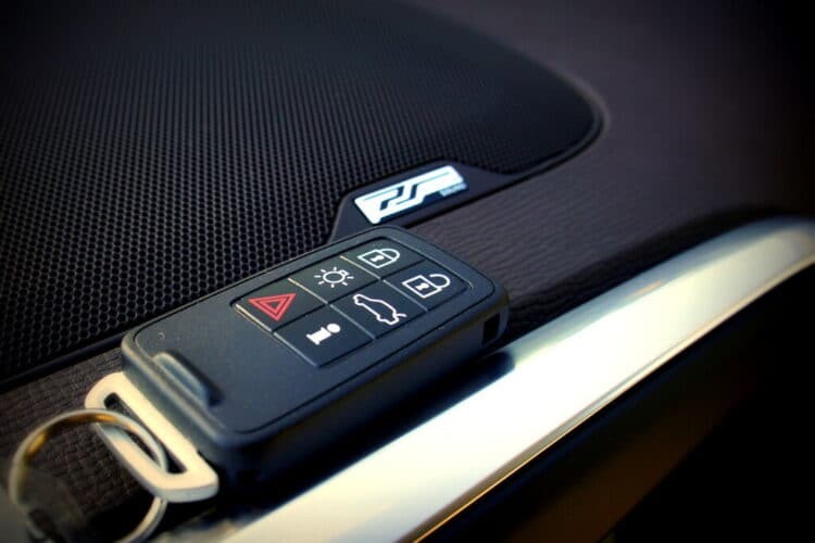 Modern car key fob with buttons for lock, unlock, and trunk release