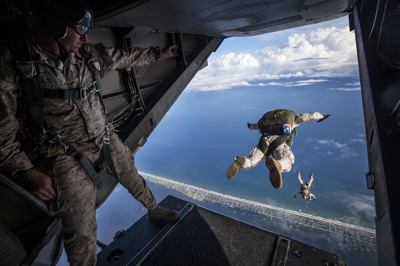 Paratrooper representing military personnel eligible for national benefits programs, including car purchase discounts.