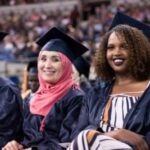 three smiling grads