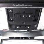 HomeLink buttons typically located on the car's top console for programming garage door openers.