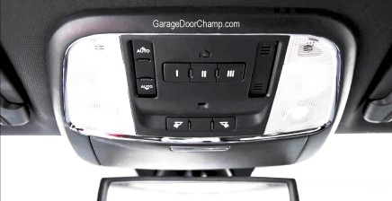 HomeLink buttons typically located on the car's top console for programming garage door openers.