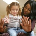 Children playing in a historical orphanage evoking early foster care concepts